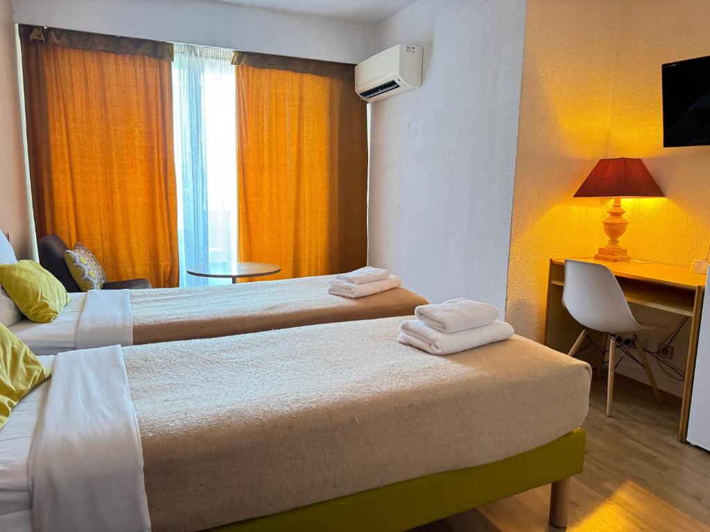 Postel nebo postele na pokoji v ubytování Hotel Panorama