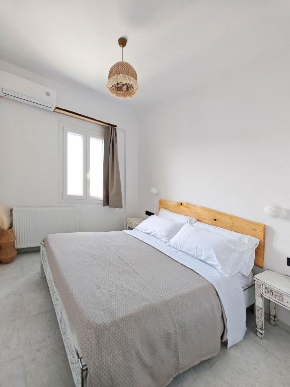 Postel nebo postele na pokoji v ubytování Paraga Suites
