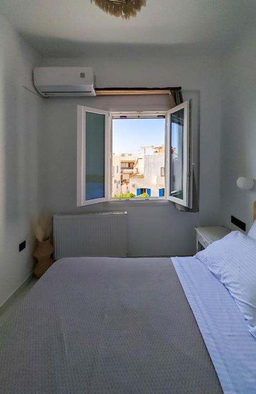 Postel nebo postele na pokoji v ubytování Paraga Suites