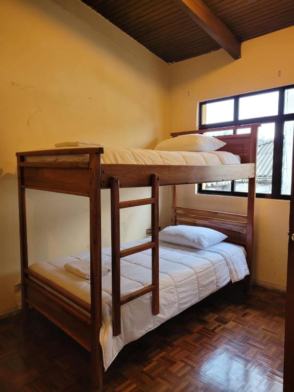 Postel nebo postele na pokoji v ubytování Casa Colon Quito Bed & Breakfast Hostel