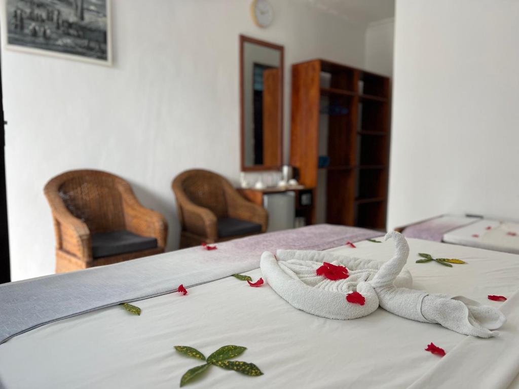 Postel nebo postele na pokoji v ubytování Nungwi Beach Front
