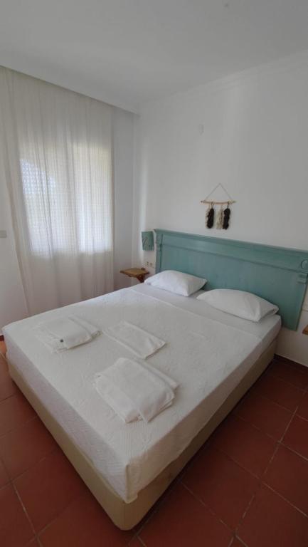 En eller flere senge i et værelse på Kybele Adrasan Otel