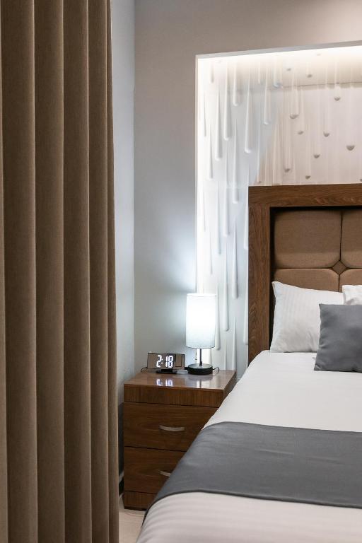 Postel nebo postele na pokoji v ubytování Hotel Arthemisa