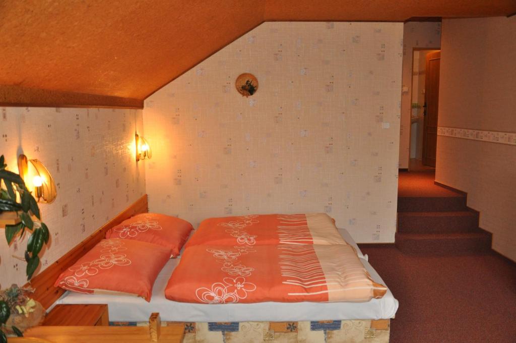 Postel nebo postele na pokoji v ubytování Pension Nostalgie