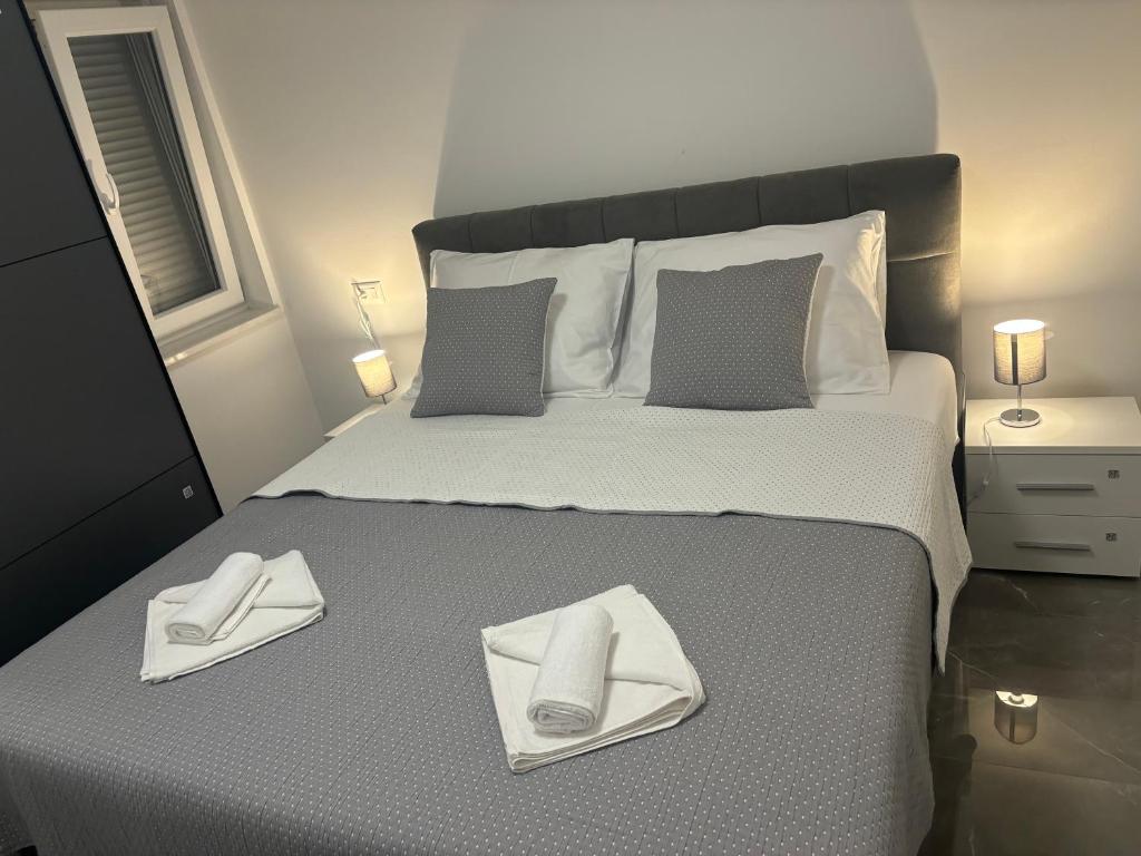 Postel nebo postele na pokoji v ubytování Apartman TINI 2