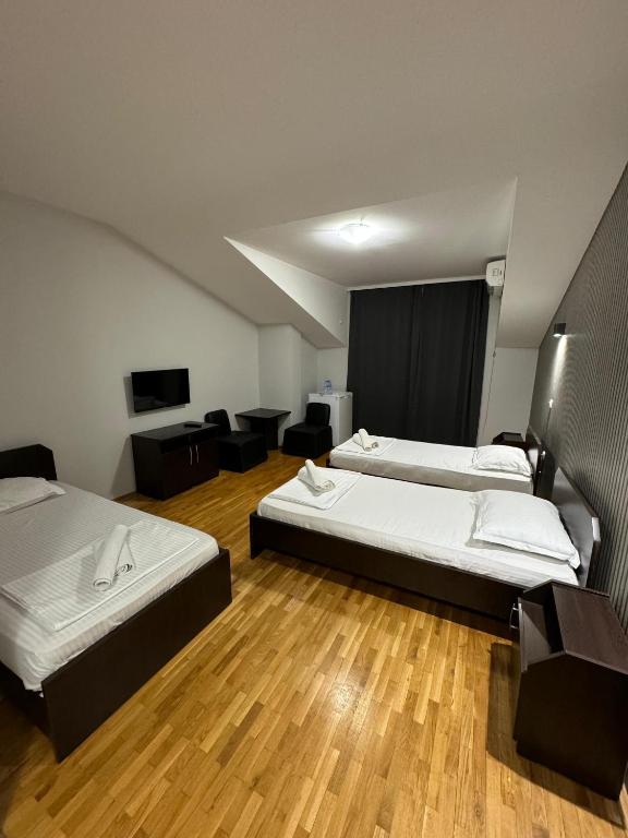Postel nebo postele na pokoji v ubytování Apartments Philip II