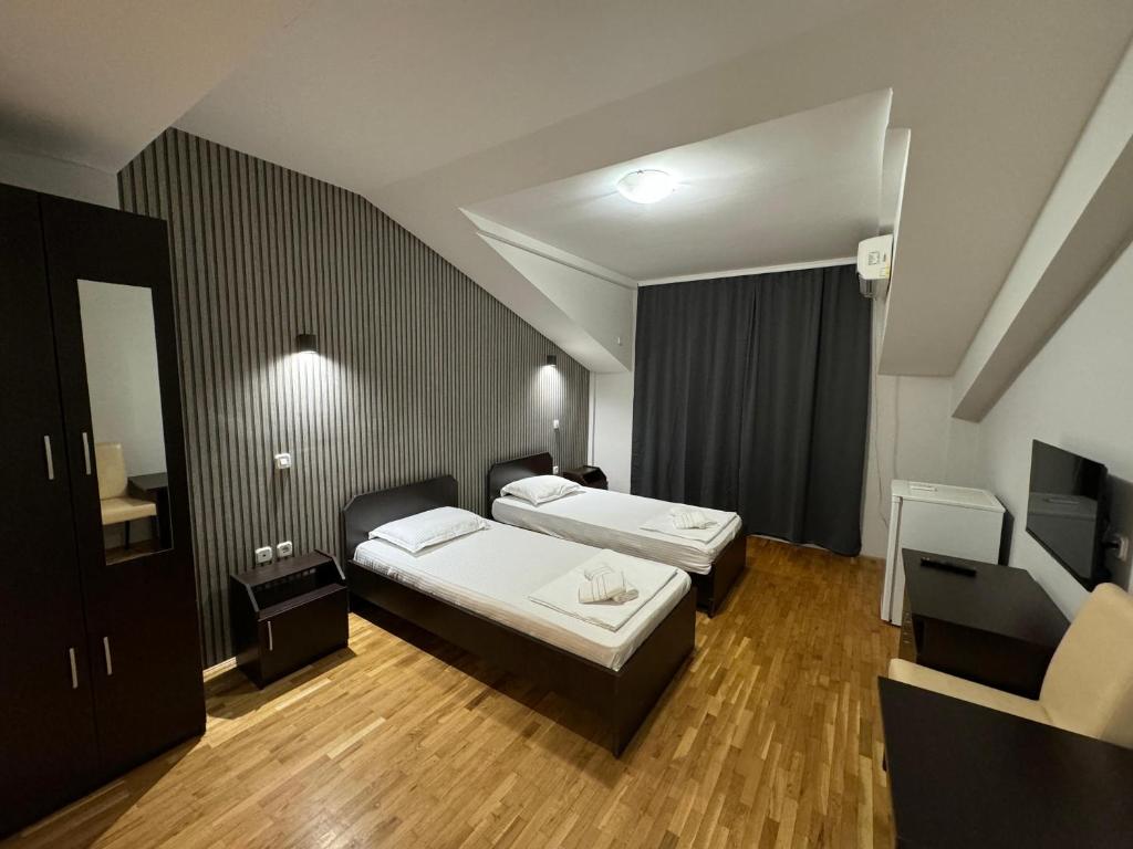 Postel nebo postele na pokoji v ubytování Apartments Philip II