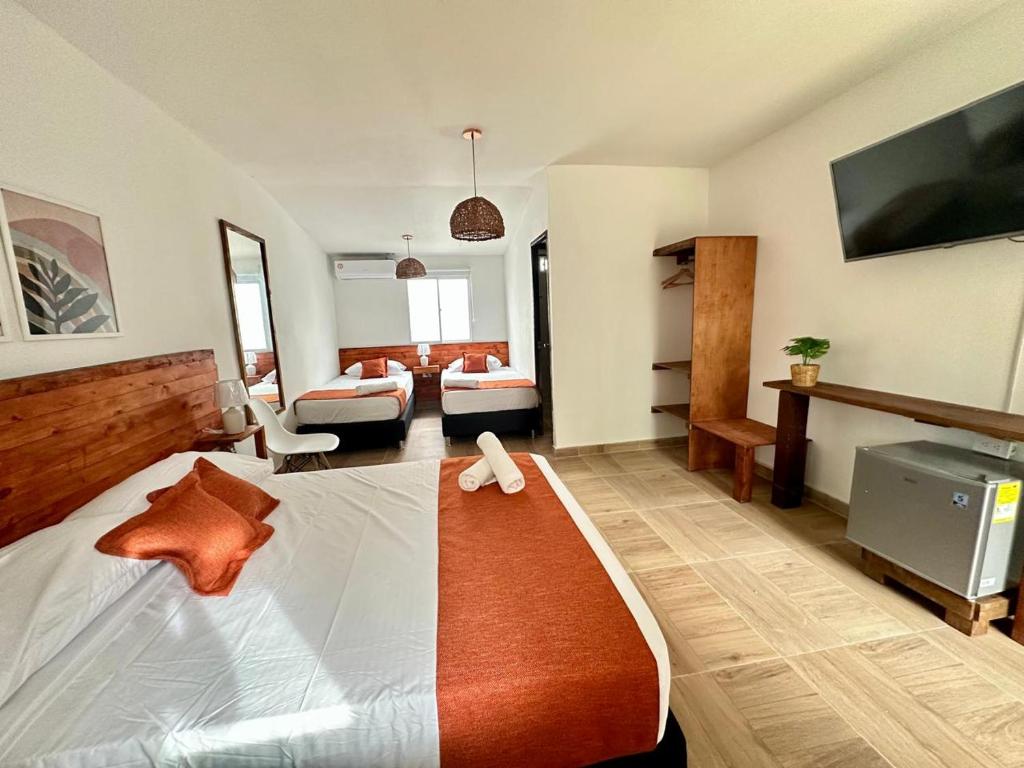 Cama ou camas em um quarto em Eco-Hotel Palma É Coco