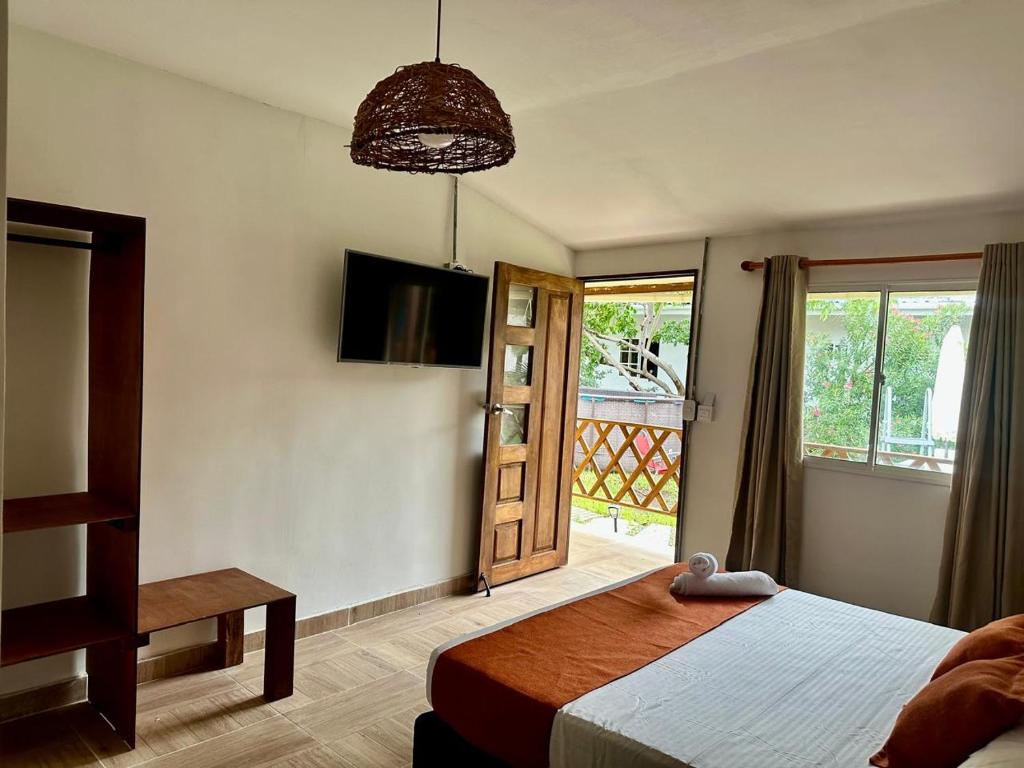 Cama ou camas em um quarto em Eco-Hotel Palma É Coco