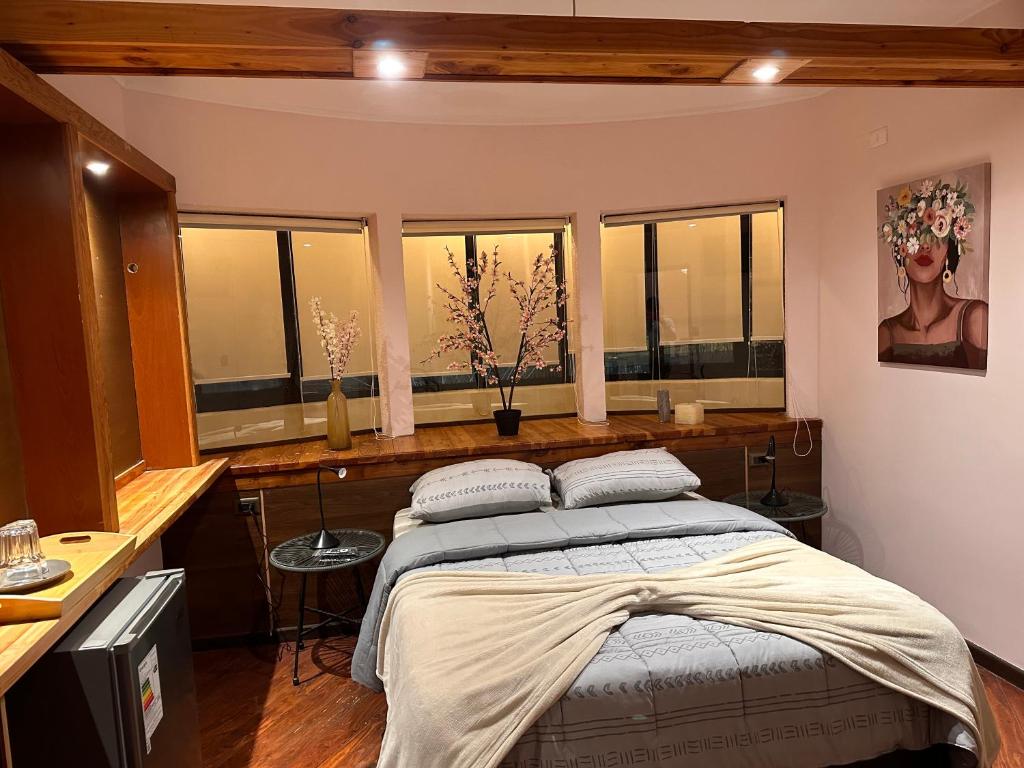 Postel nebo postele na pokoji v ubytování hostal flor de viña del mar