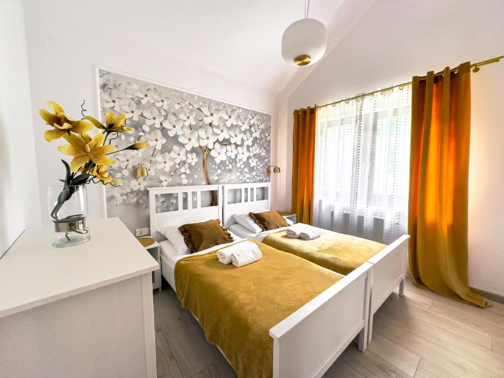 Posteľ alebo postele v izbe v ubytovaní Apartament Złoty Las Karpatia