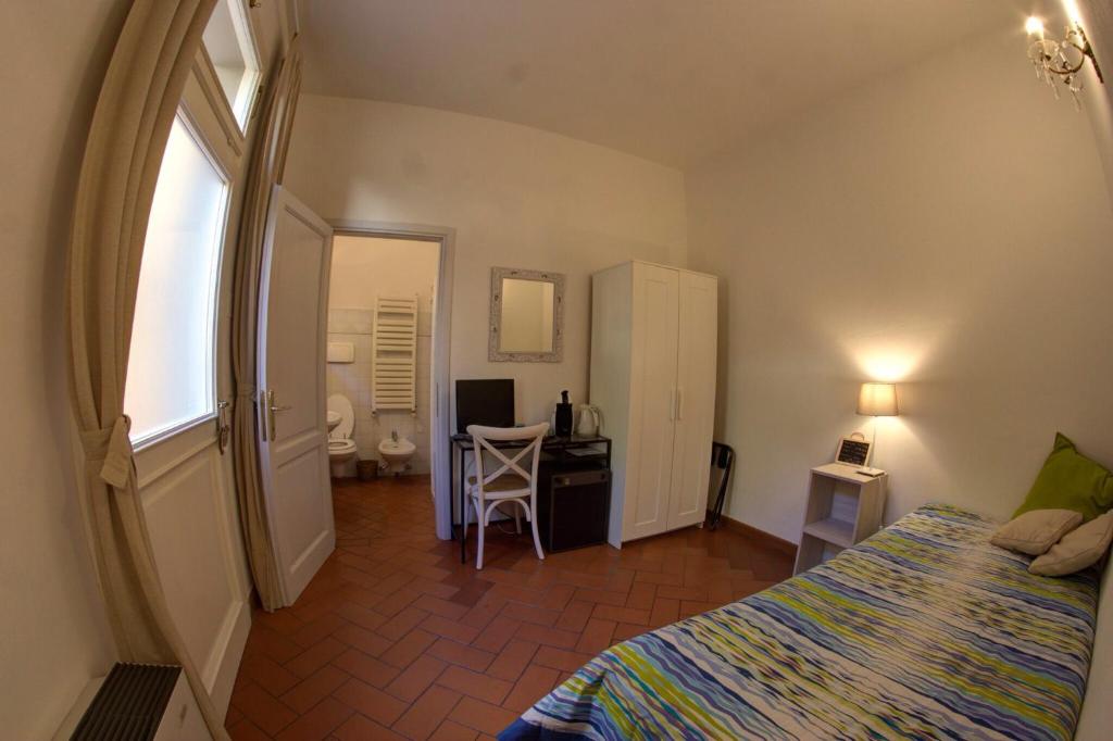 A bed or beds in a room at Cosy House