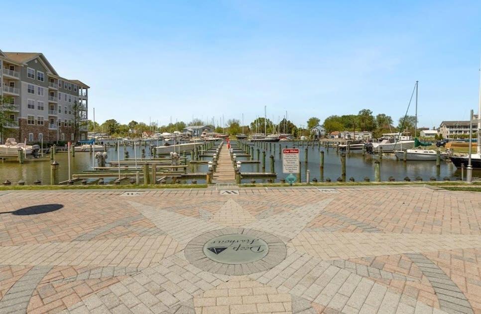 a marina with boats in the water and a star at New Intown Waterfront Townhome wPool & Location in Cambridge