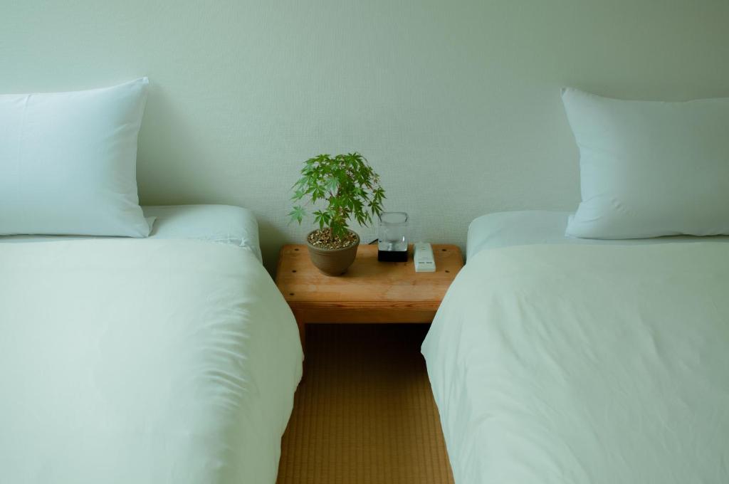 Postel nebo postele na pokoji v ubytování Hostel Mt. Fuji - FUKUYA