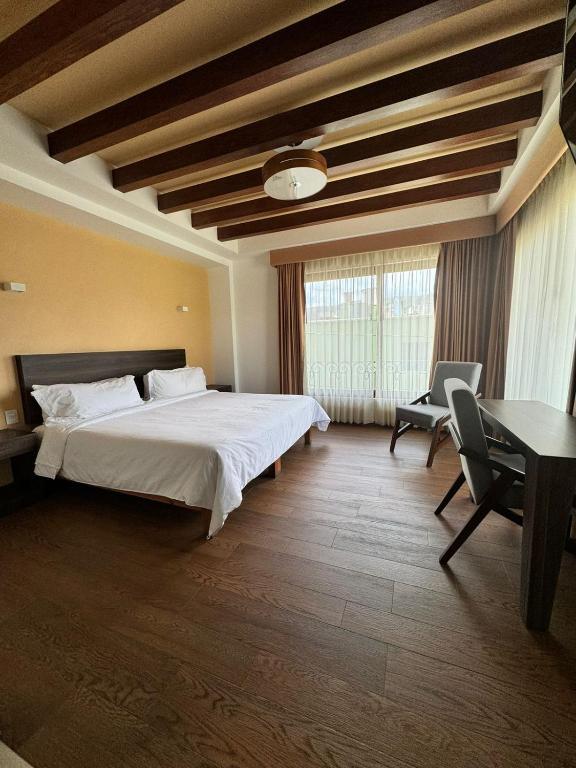 Postel nebo postele na pokoji v ubytování Hotel Casa Rubio