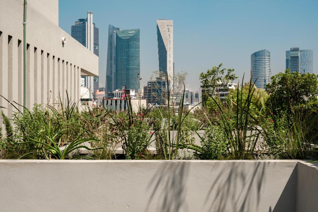 a view of a city skyline with tall buildings at Casa Cibeles by Lumina in Mexico City