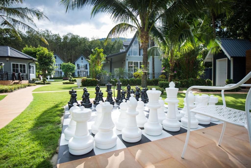 a giant chessboard on a table in a yard at Grande Sun Seaside Villas Koh Chang in Ban Dan Kao