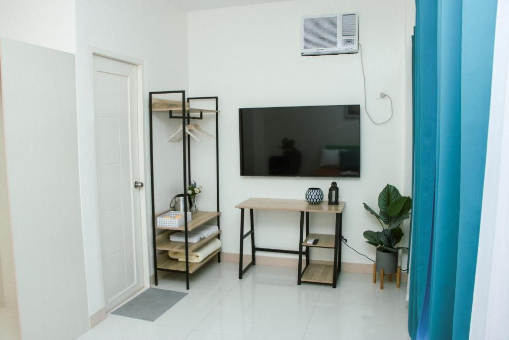 TV a/nebo společenská místnost v ubytování Amar Residence