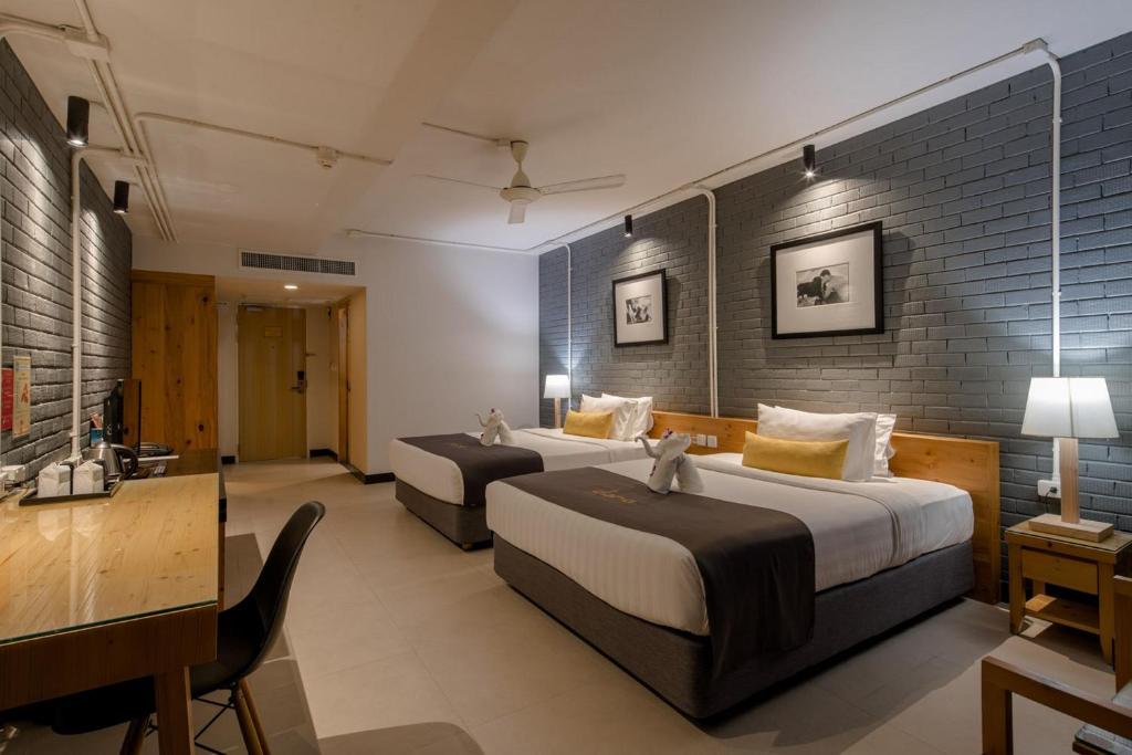 Postel nebo postele na pokoji v ubytování DARA Hotel - SHA Plus