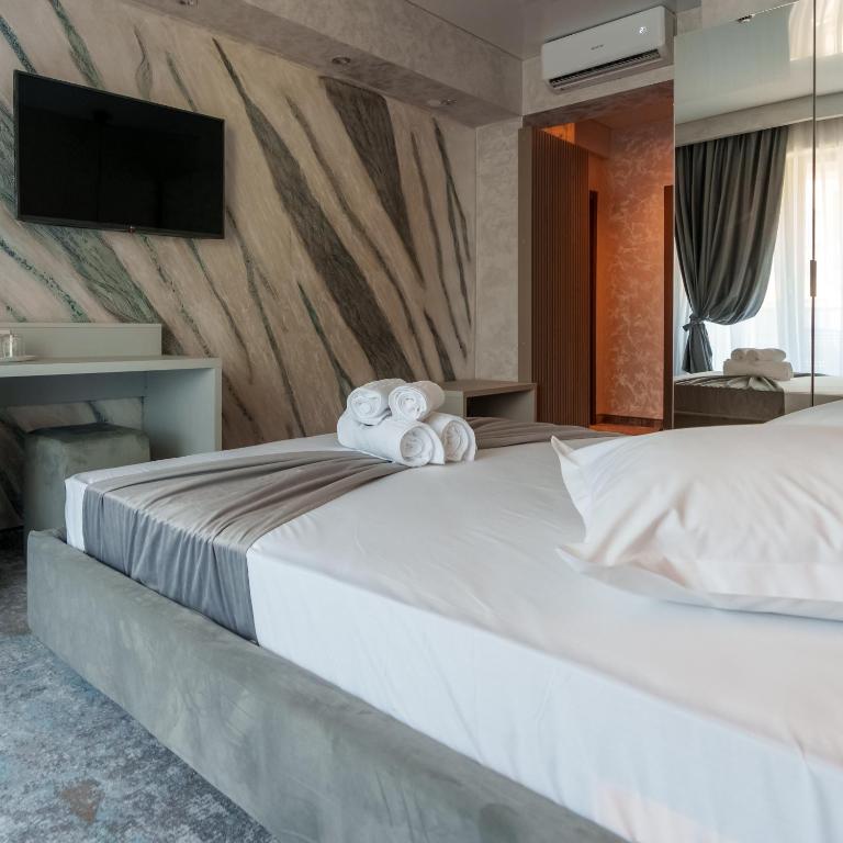 Postel nebo postele na pokoji v ubytování HOTEL KALYA