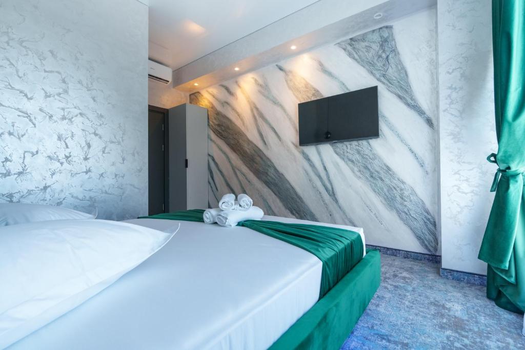 Postel nebo postele na pokoji v ubytování HOTEL KALYA