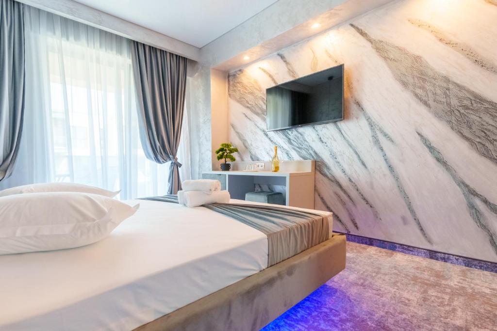Postel nebo postele na pokoji v ubytování HOTEL KALYA
