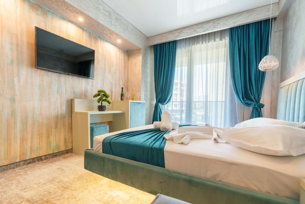 Postel nebo postele na pokoji v ubytování HOTEL KALYA