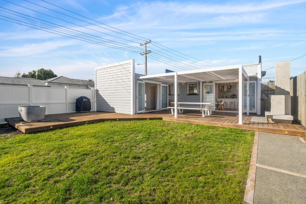 a modern house with a large backyard at The Olive Corner- Martinborough Holiday Home in Martinborough 