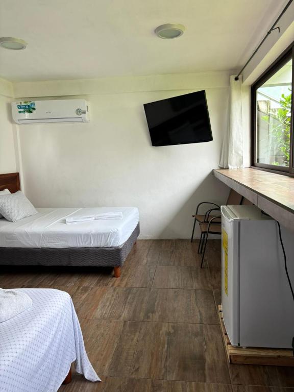 Postel nebo postele na pokoji v ubytování Hotel Miriam Bacalar