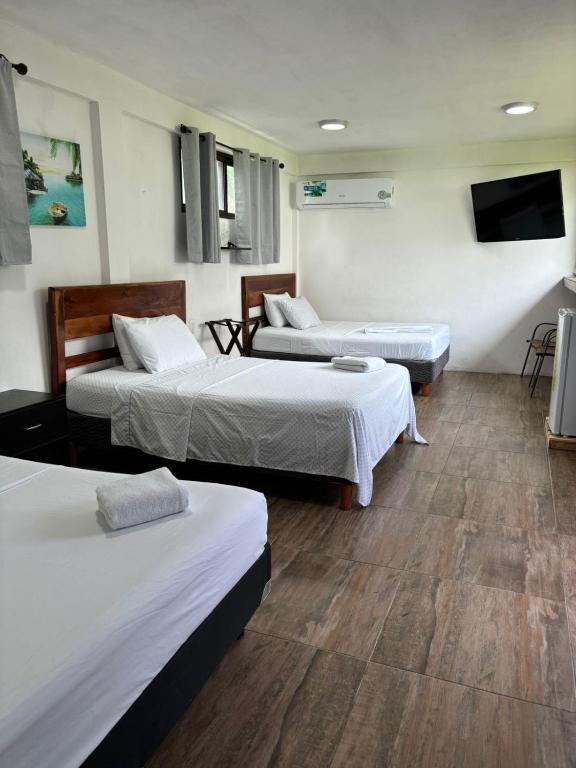 Postel nebo postele na pokoji v ubytování Hotel Miriam Bacalar