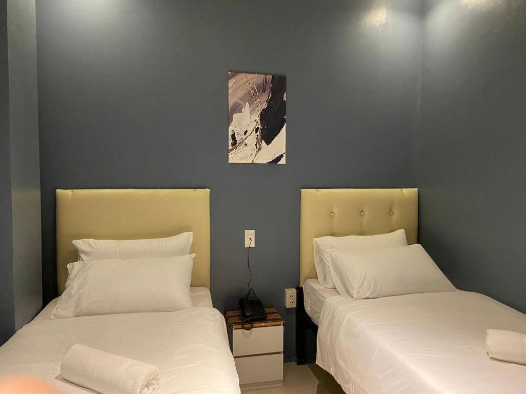 Postel nebo postele na pokoji v ubytování IAO Boutique Hotel