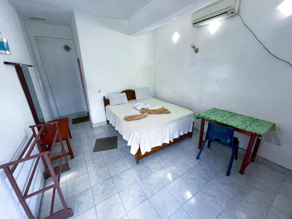 Postel nebo postele na pokoji v ubytování New Uduwara Guest