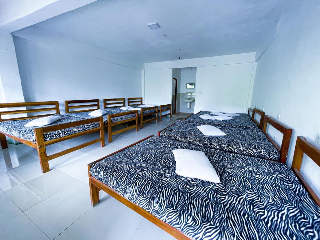 Postel nebo postele na pokoji v ubytování New Uduwara Guest
