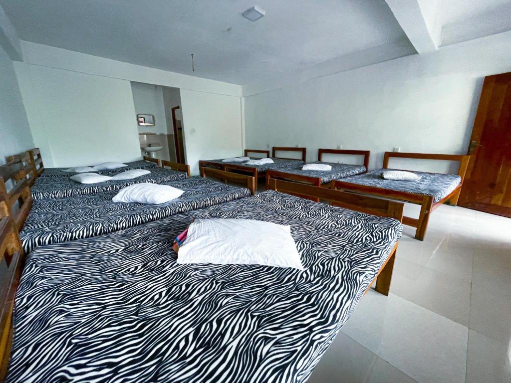 Postel nebo postele na pokoji v ubytování New Uduwara Guest