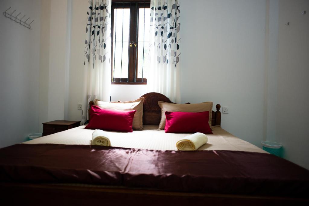 Giường trong phòng chung tại Sun Lanka Hikkaduwa