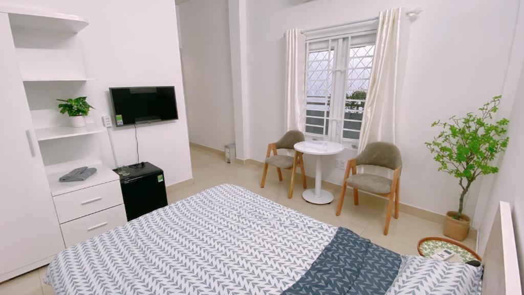 TV a/nebo společenská místnost v ubytování SAIGONESE Studio