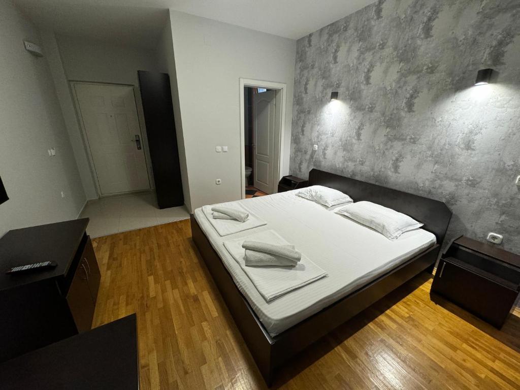 Postel nebo postele na pokoji v ubytování Apartments Philip II