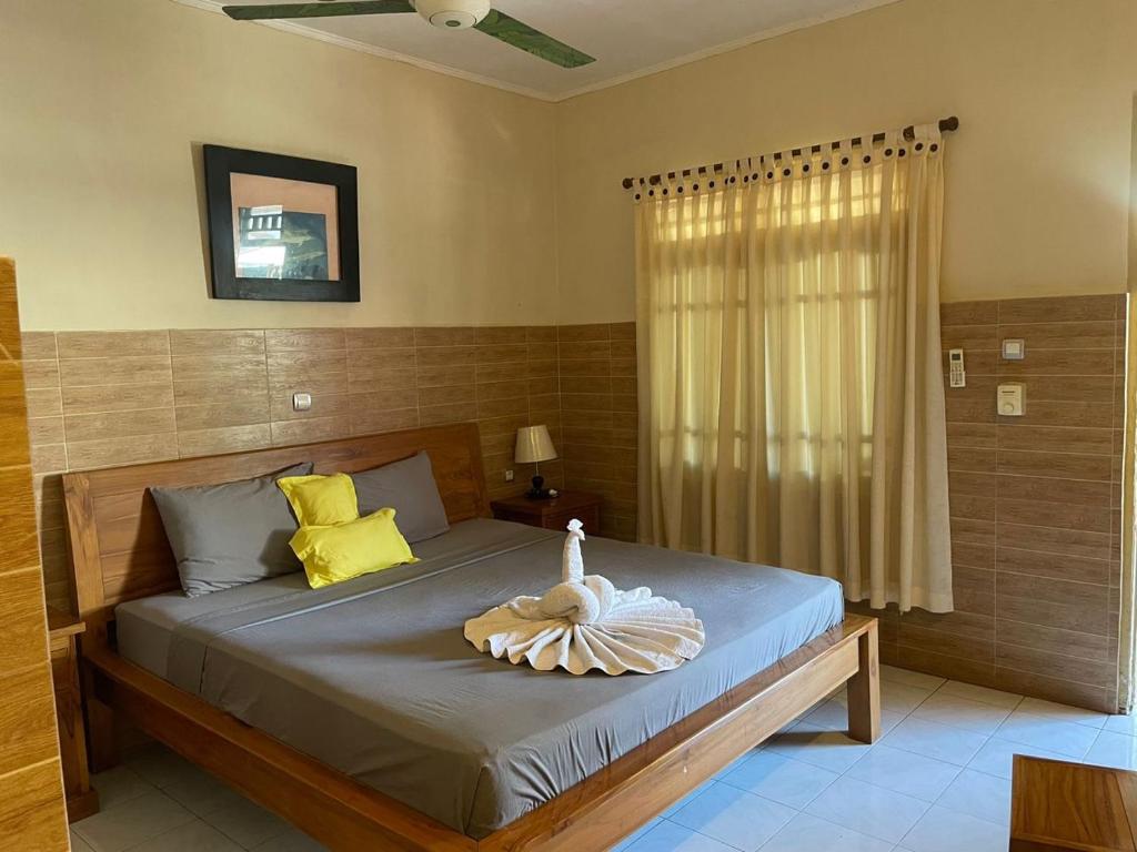Postel nebo postele na pokoji v ubytování Lita Homestay