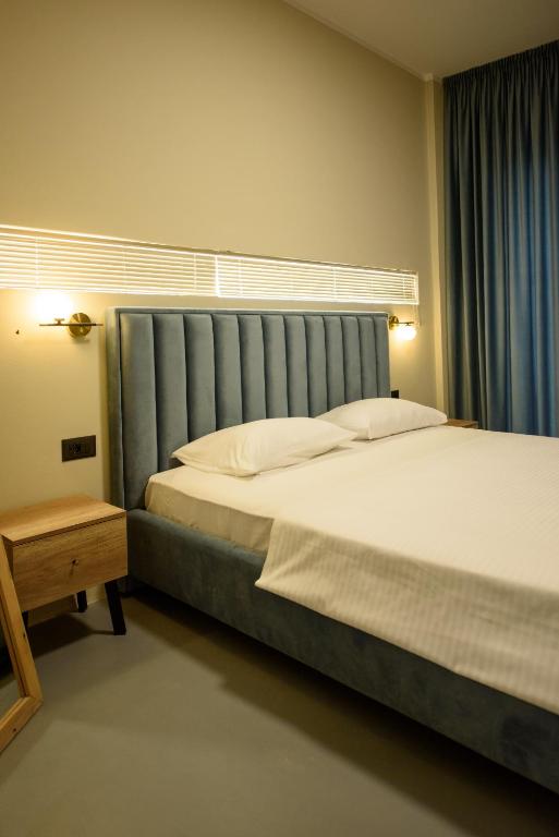 Postel nebo postele na pokoji v ubytování Olivium Rooms