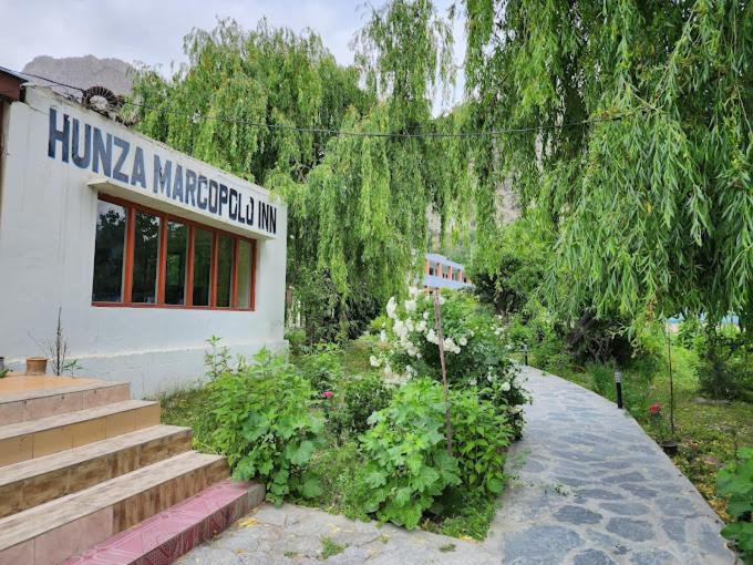 a building with a sign on the side of it at Hunza Marcopolo Inn Gulmit in Gulmit