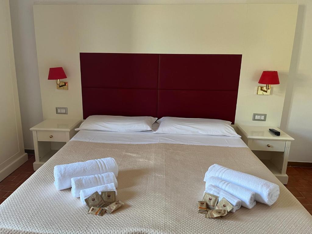 Postel nebo postele na pokoji v ubytování TC HOTEL
