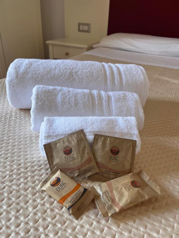 Postel nebo postele na pokoji v ubytování TC HOTEL