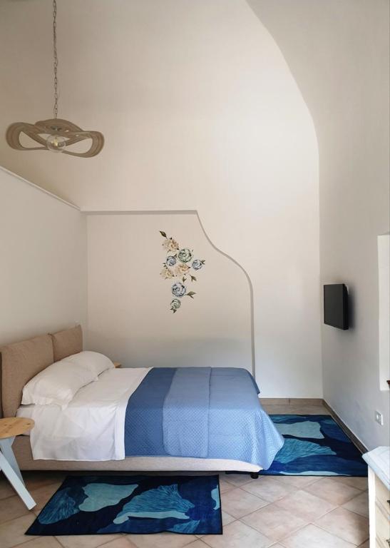 Postel nebo postele na pokoji v ubytování La casa delle Camelie