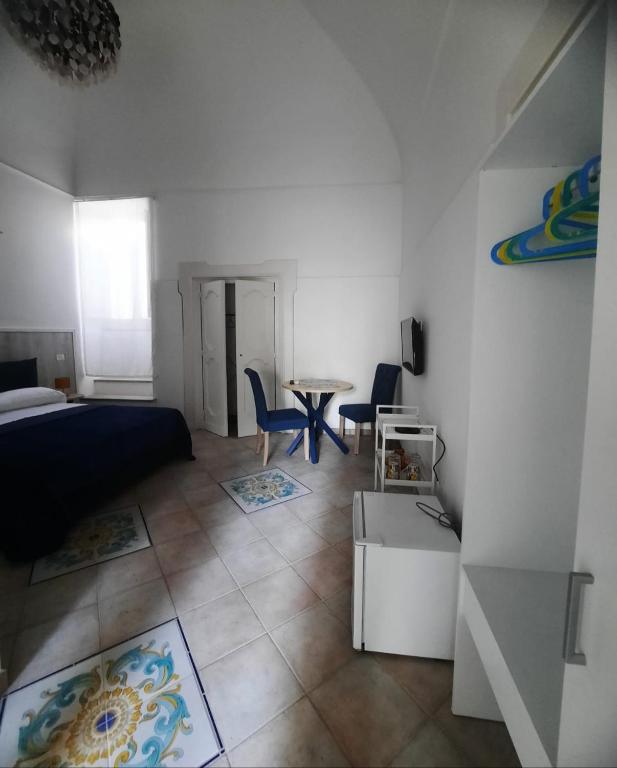 Postel nebo postele na pokoji v ubytování La casa delle Camelie