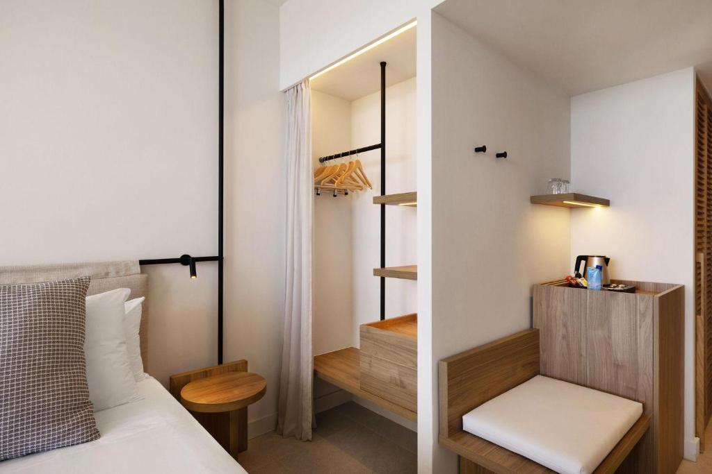 a bedroom with a bed and a mirror at Inmood Aucanada 4 Sup in Port d'Alcudia