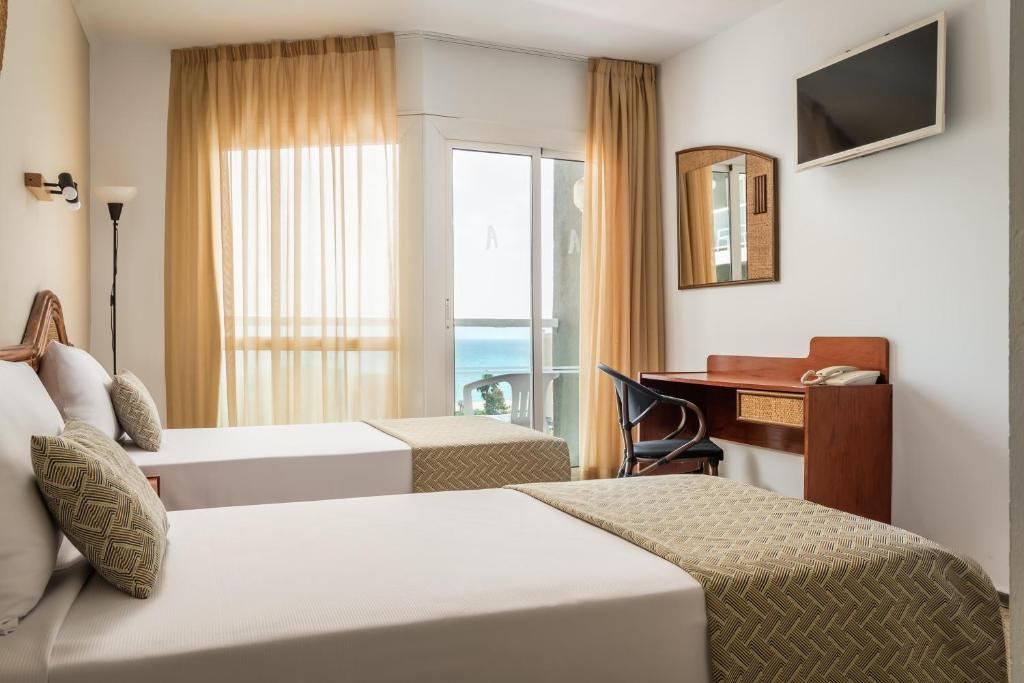 Postel nebo postele na pokoji v ubytování Hotel Cartago Nova by ALEGRIA