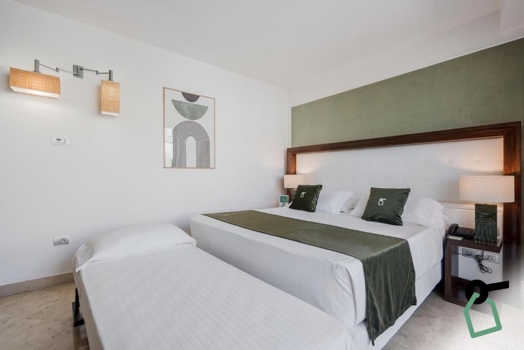 Postel nebo postele na pokoji v ubytování Hotiday Room Collection - Otranto