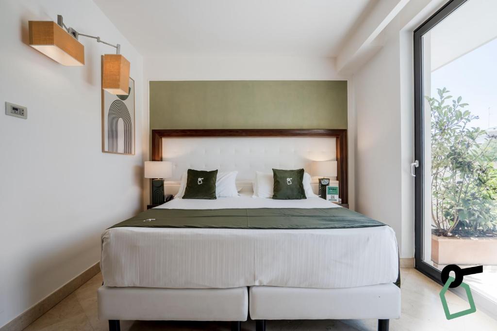 Postel nebo postele na pokoji v ubytování Hotiday Room Collection - Otranto
