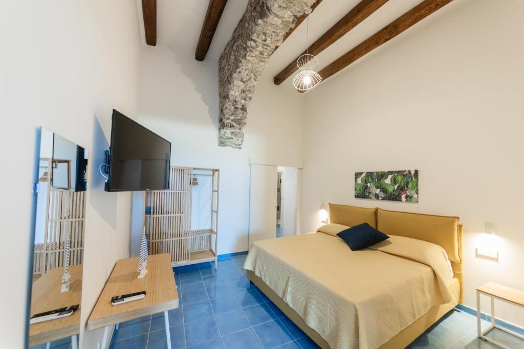Postel nebo postele na pokoji v ubytování Archi Suite Canneto