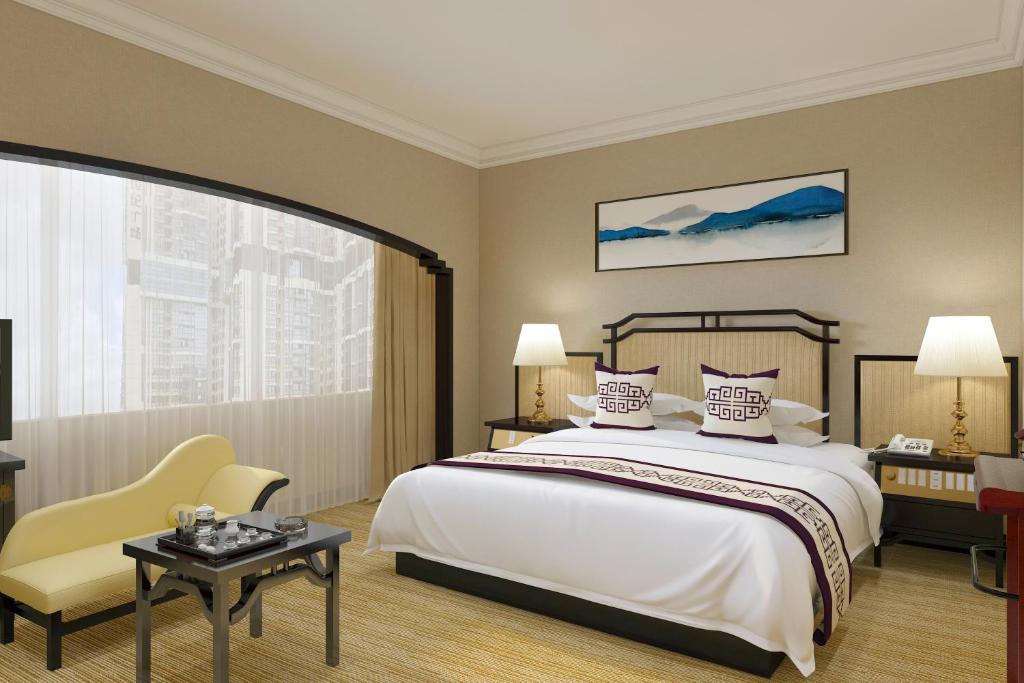 Postel nebo postele na pokoji v ubytování Yindo Jasper Hotel Zhuhai